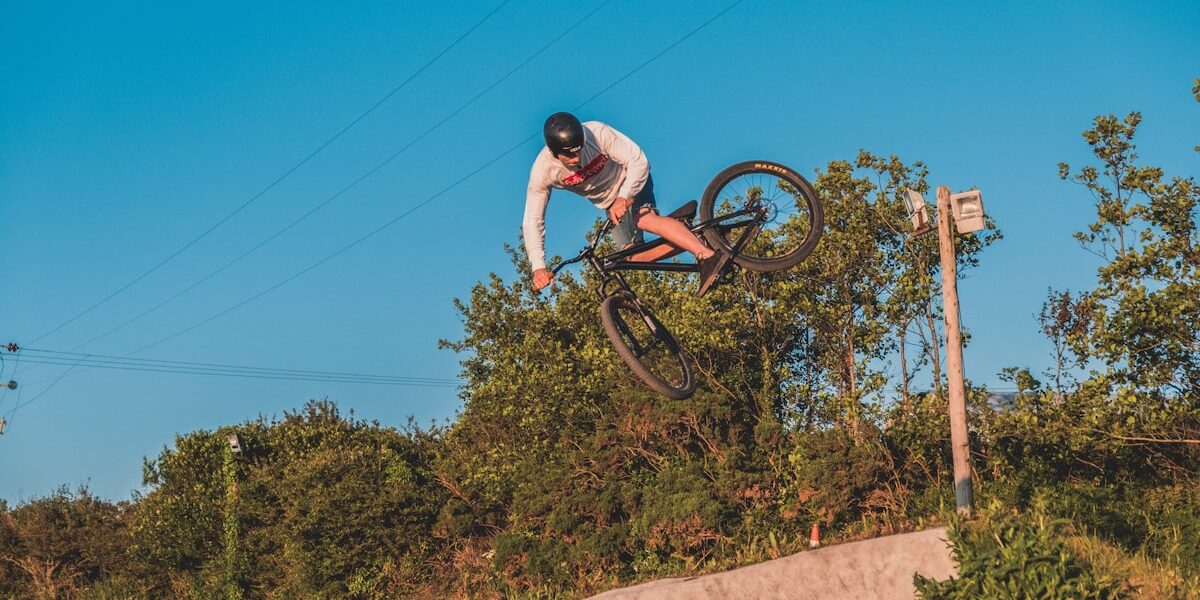 Learning to Wheelie: Balance Point and Pedal Control